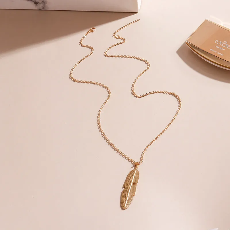 Retro feather tassel necklace for women in gold with geometric leaf pendant and feather tassel on alloy chain