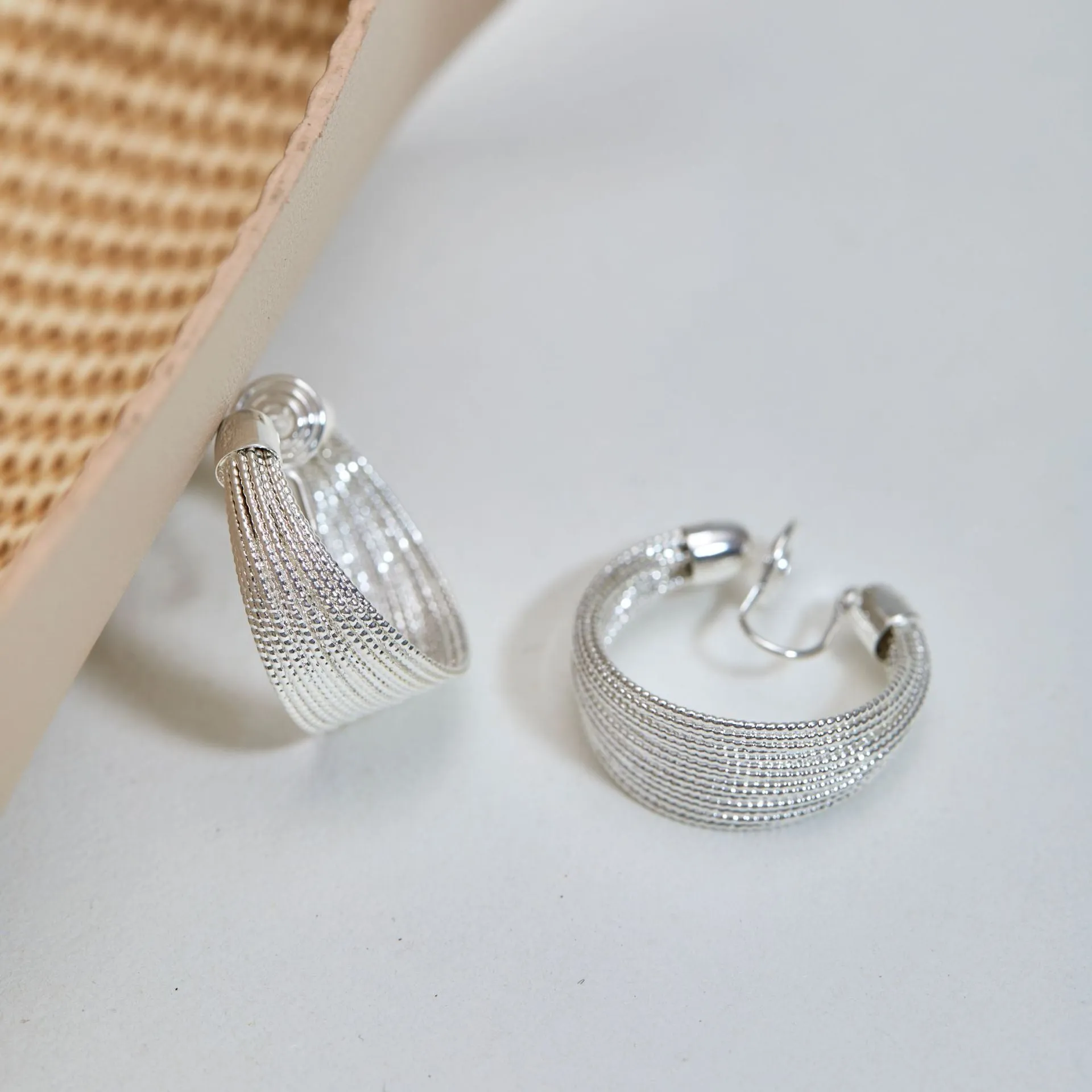 Geometric layered bracelet earrings with matching stud and clip earrings in gold or silver finishes