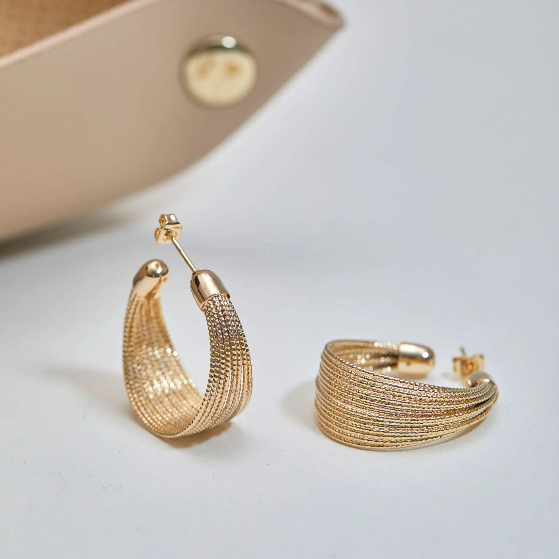 Geometric layered bracelet earrings with matching stud and clip earrings in gold or silver finishes