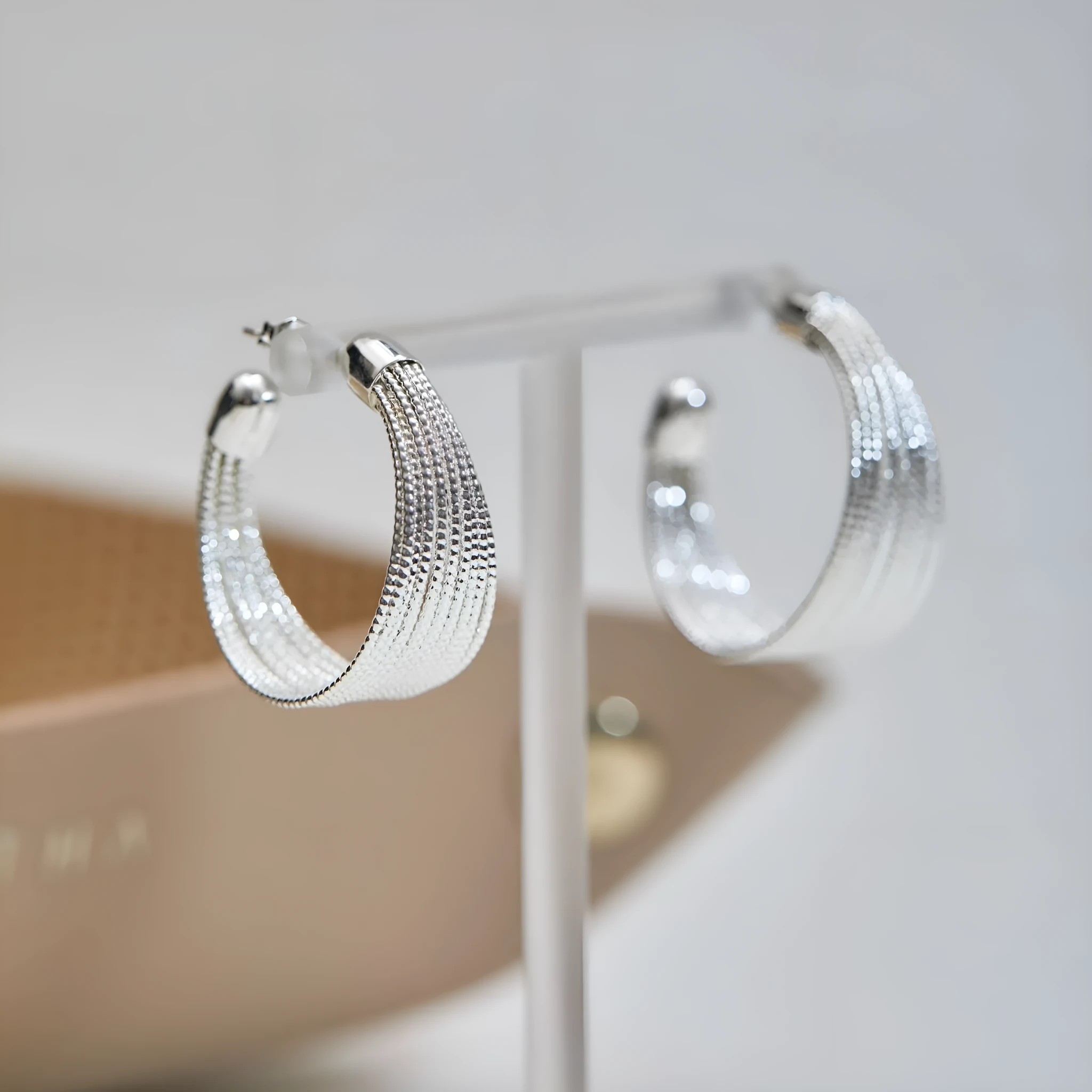 Geometric layered bracelet earrings with matching stud and clip earrings in gold or silver finishes