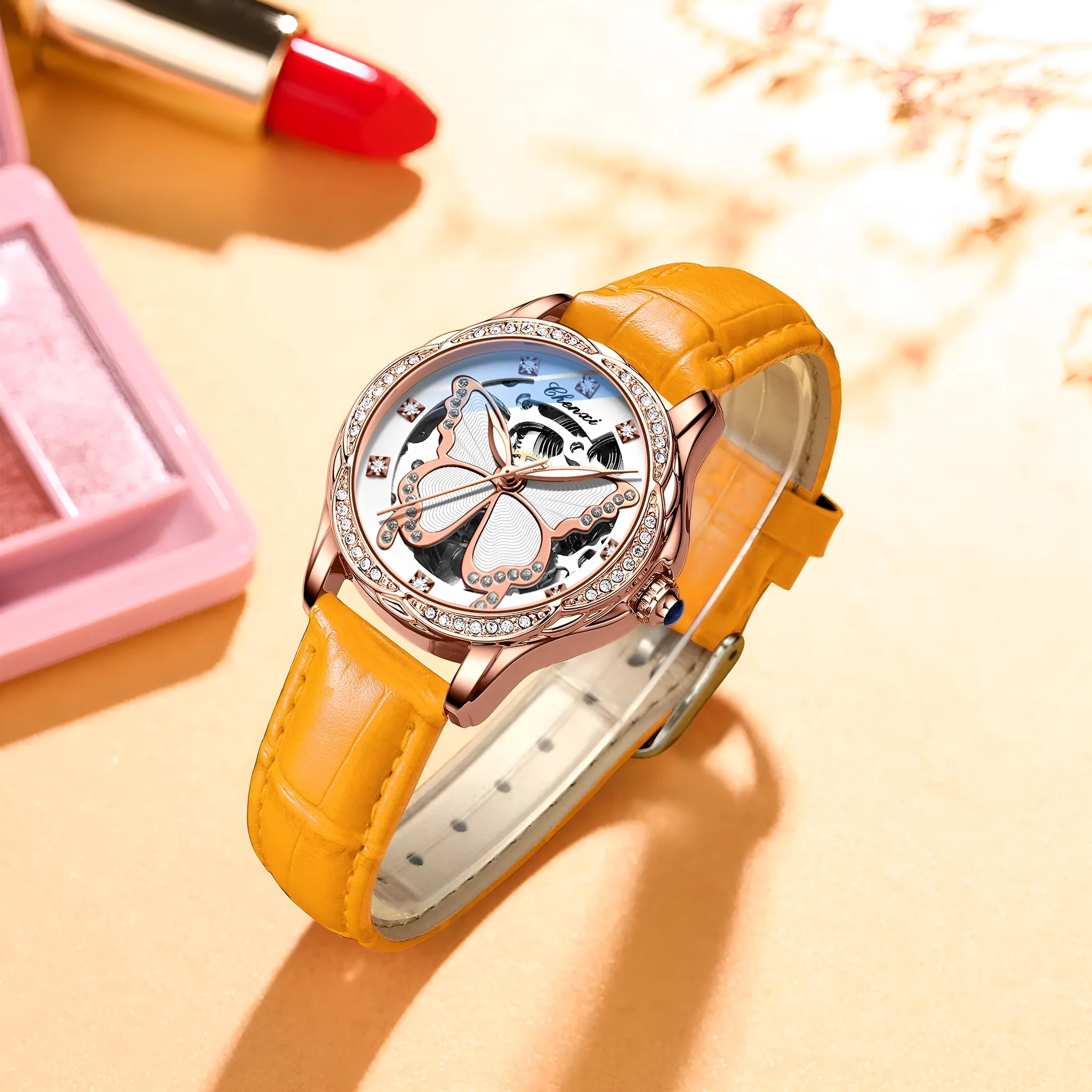 Butterfly dial diamond-embedded women's automatic mechanical watch with genuine leather strap and pin buckle on a white background