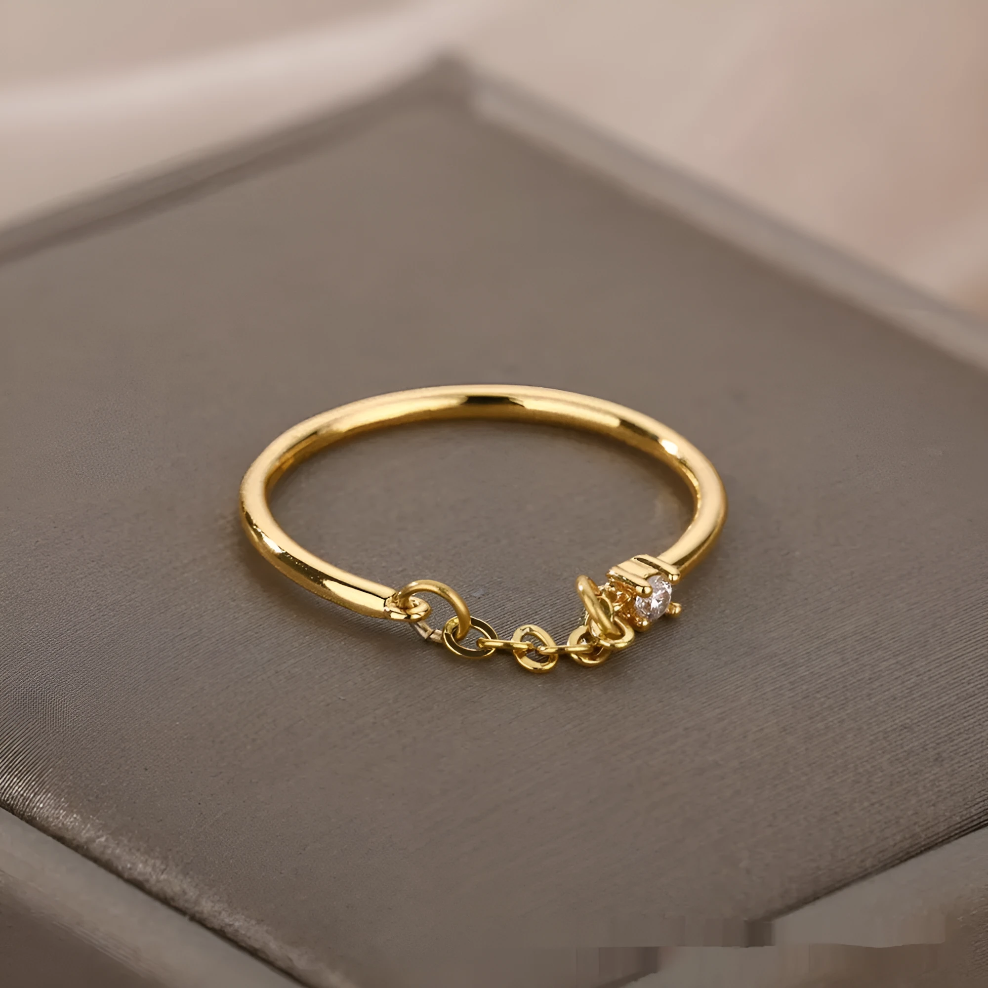 Double-layer cross frame ring in stainless steel, wave shaped, unisex style with electroplated finish available in multiple colours