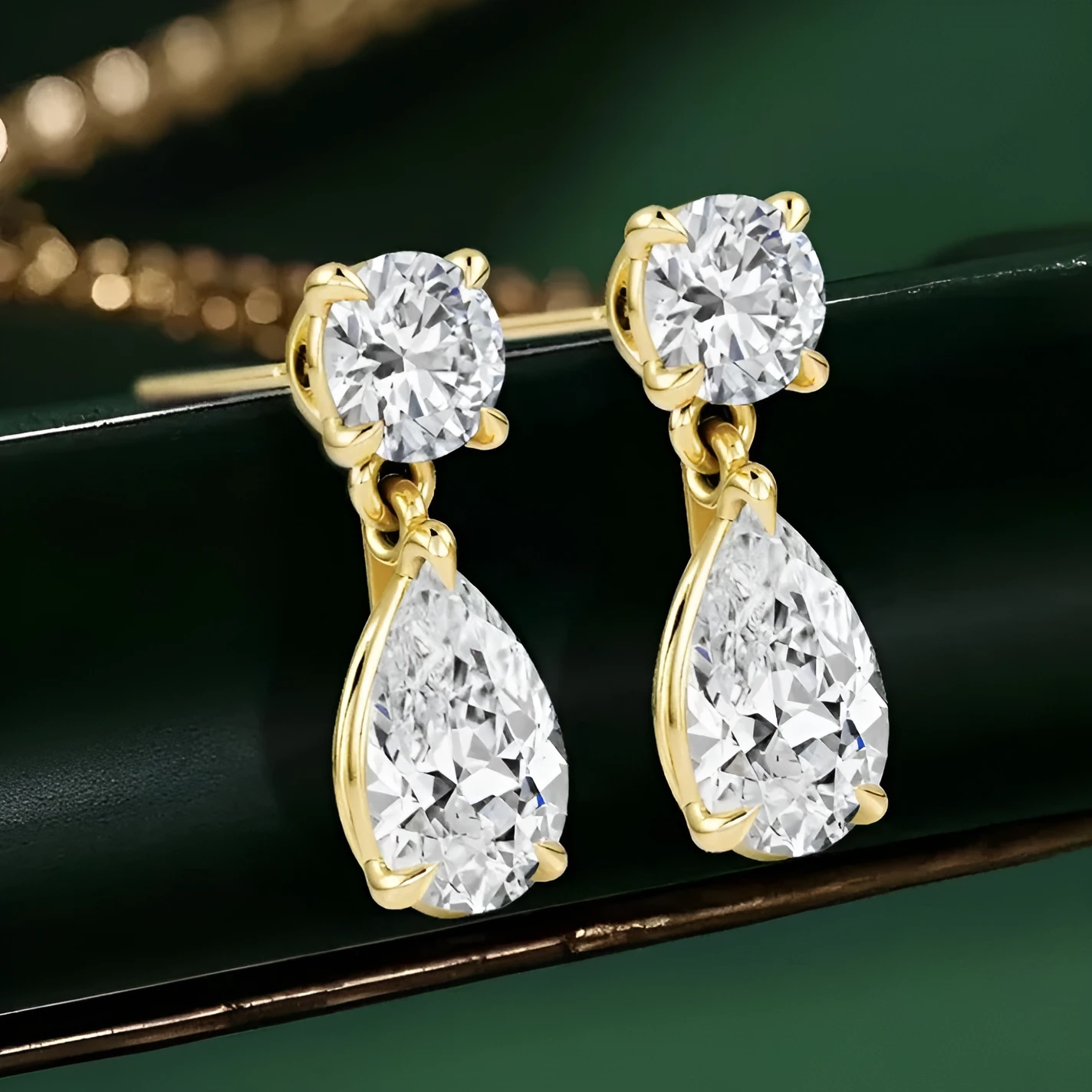 Two pairs of moissanite stud earrings: round stones and water drop shapes in gold or silver plating