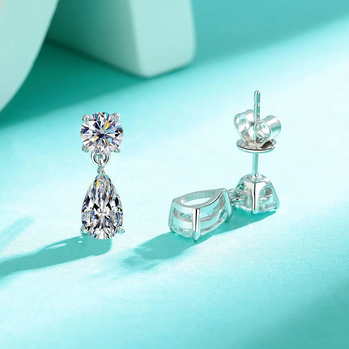 Two pairs of moissanite stud earrings: round stones and water drop shapes in gold or silver plating
