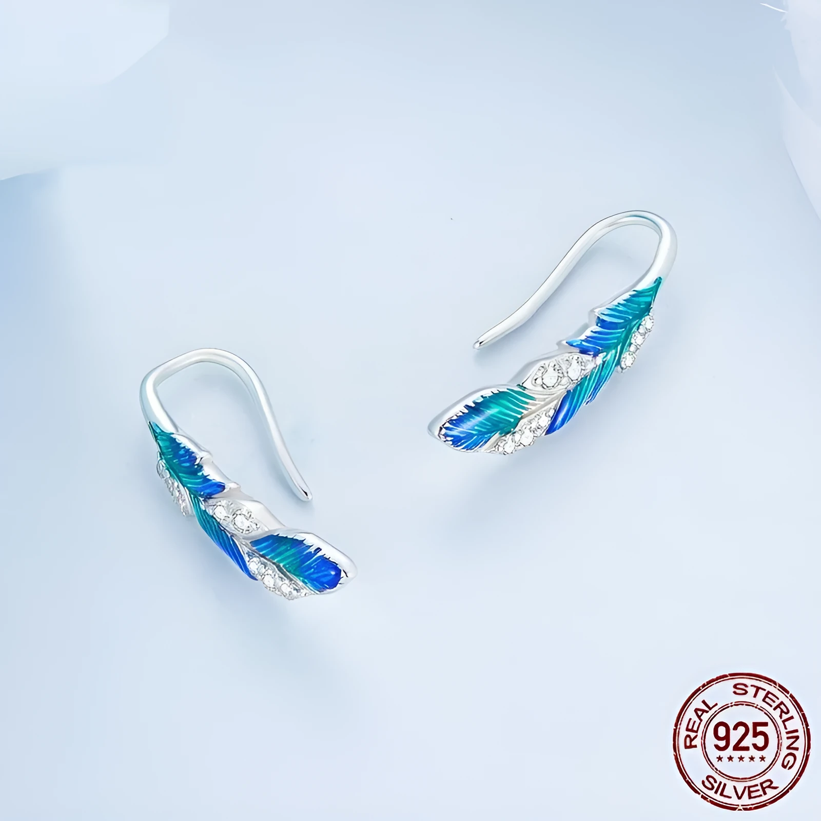 Pair of bright blue gradient feather wing stud earrings white gold plated over 925 silver