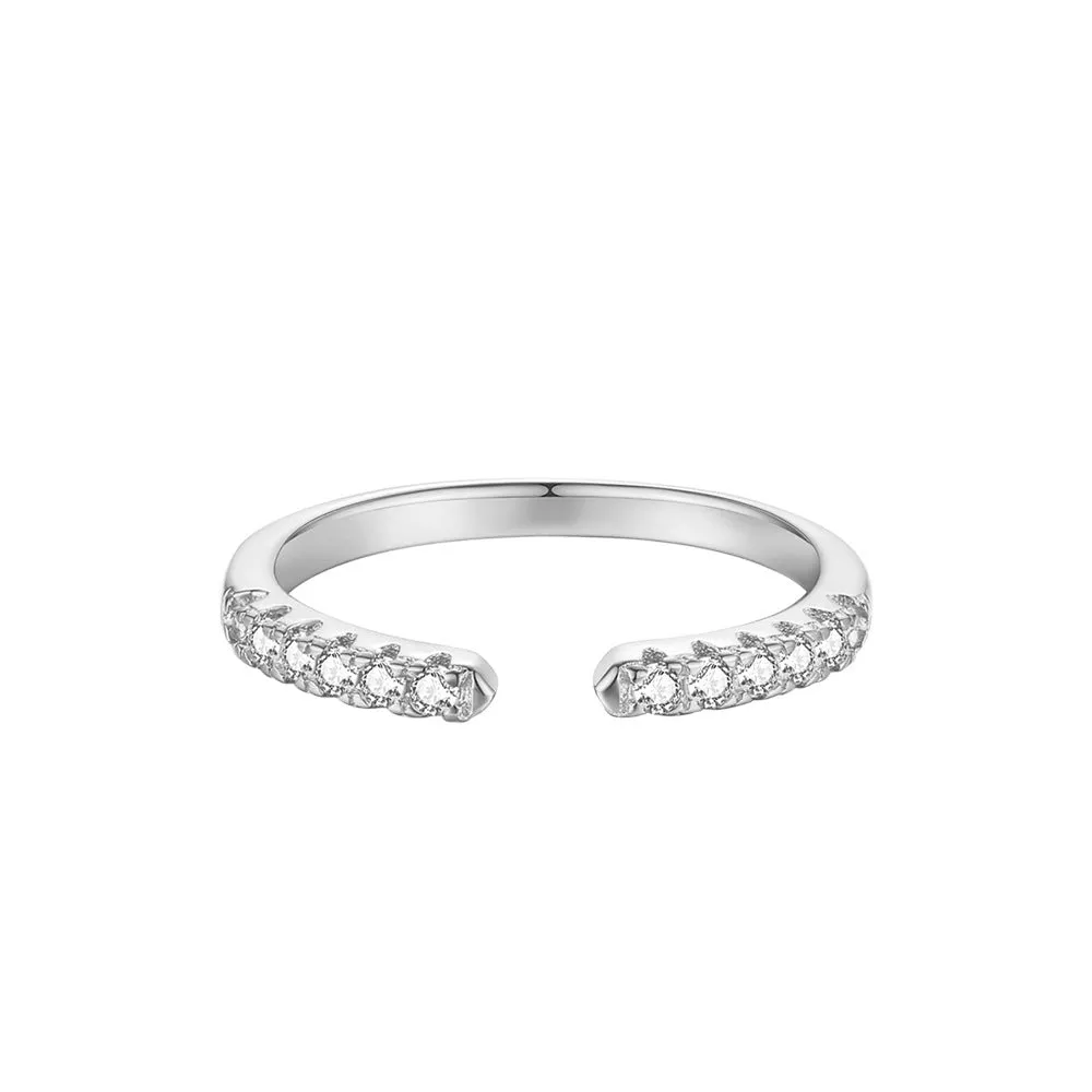Silver adjustable opening ring with electroplated gold finish, geometric shape with round element on plain background