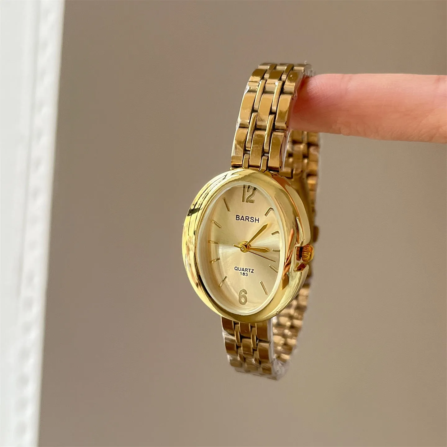 Oval alloy ladies watch with gold strap and choice of white gold or red dial face stainless steel back