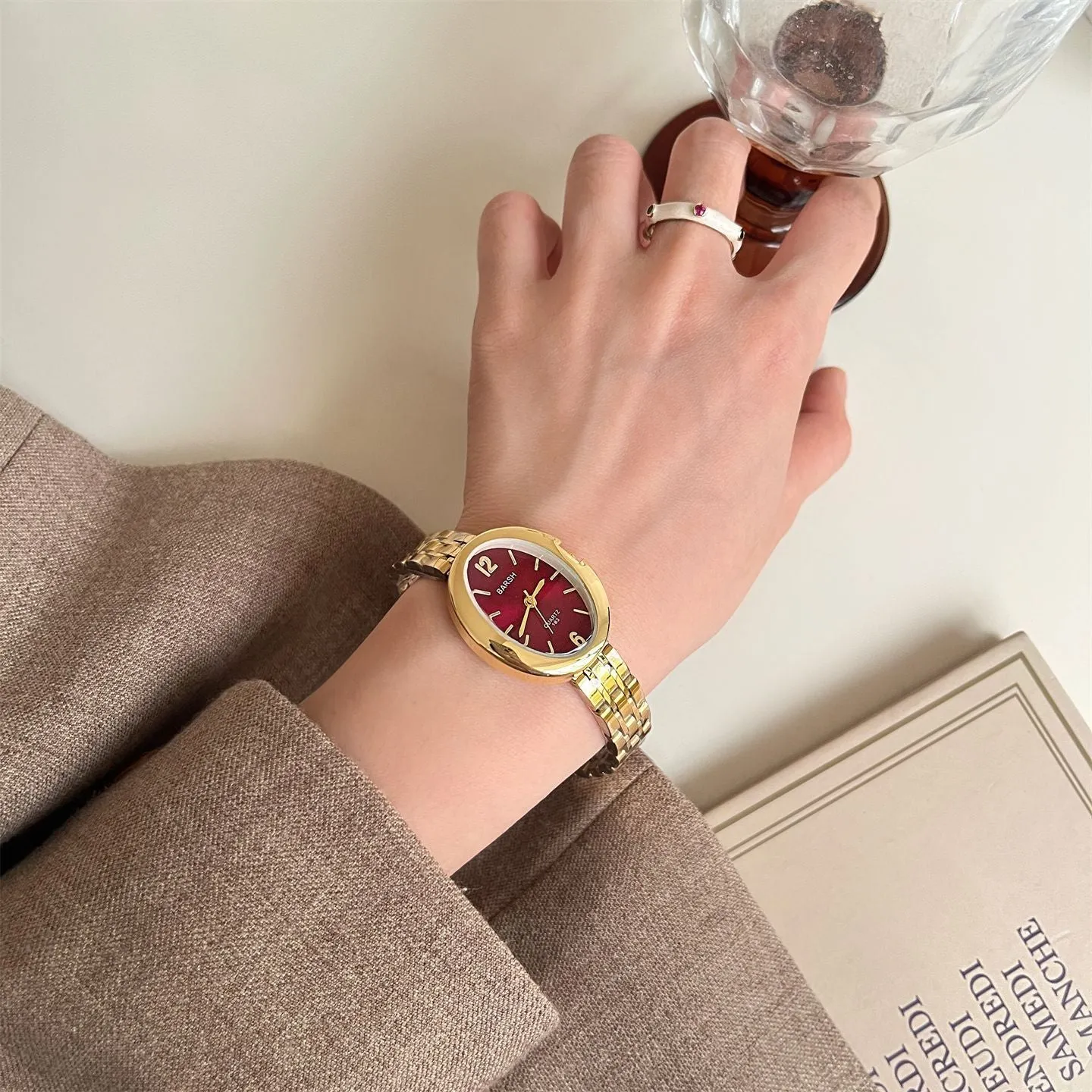 Oval alloy ladies watch with gold strap and choice of white gold or red dial face stainless steel back
