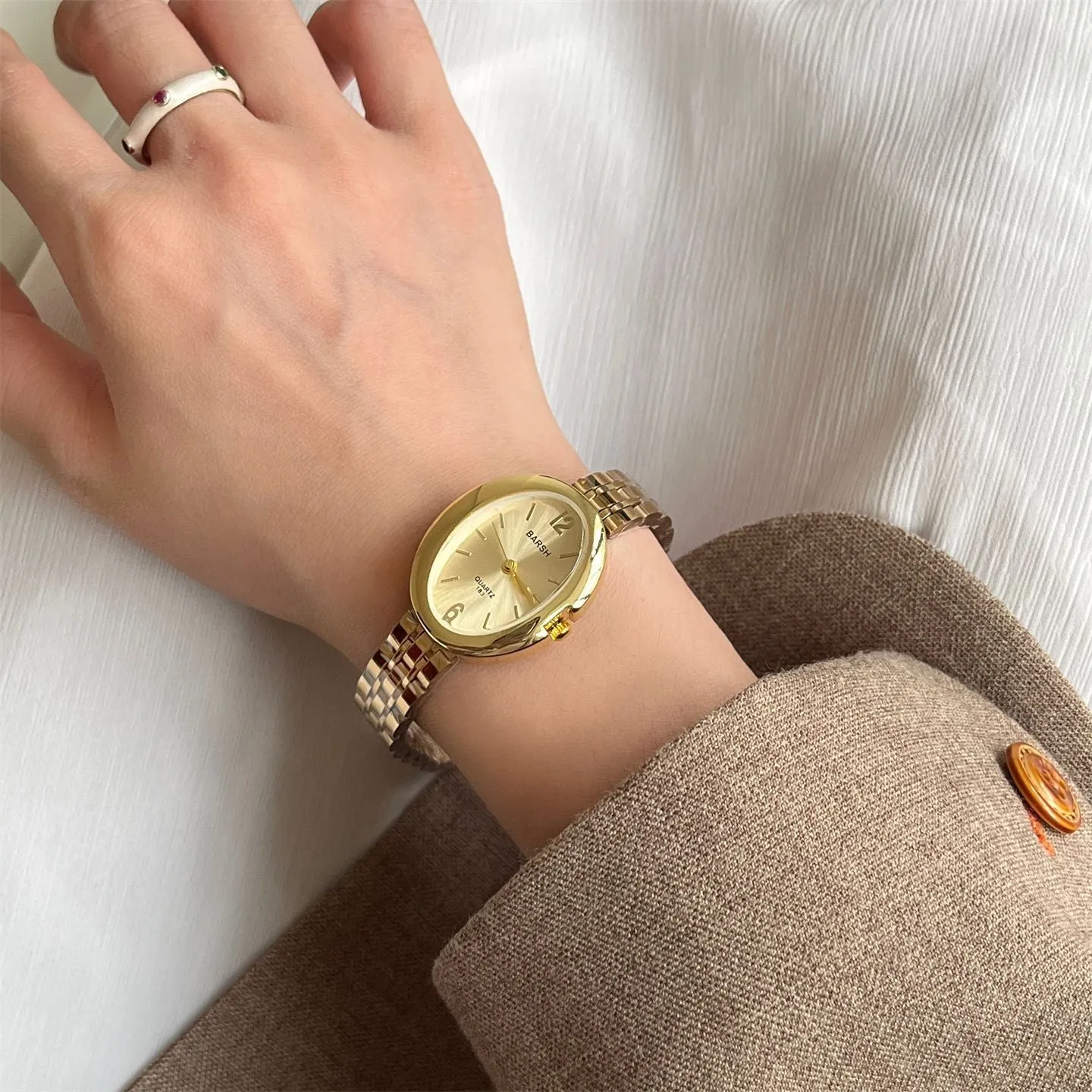 Oval alloy ladies watch with gold strap and choice of white gold or red dial face stainless steel back
