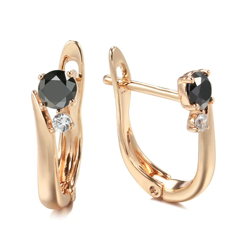 Gold-coloured drop earrings with geometric black agate design and retro styling