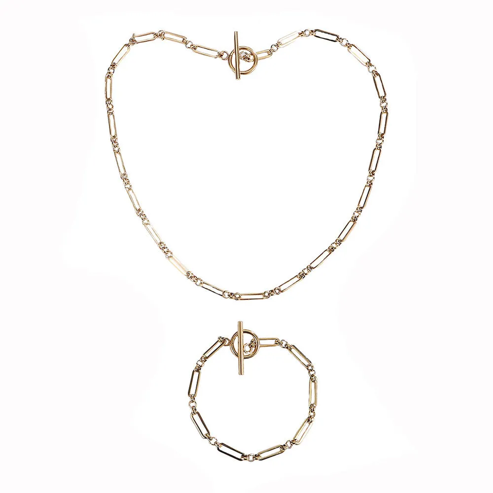 Stainless steel Chopin chain necklace and bracelet set in gold finish on white background
