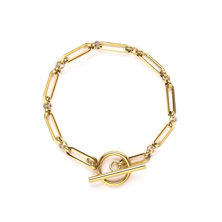 Stainless steel Chopin chain necklace and bracelet set in gold finish on white background