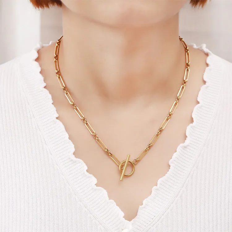 Stainless steel Chopin chain necklace and bracelet set in gold finish on white background