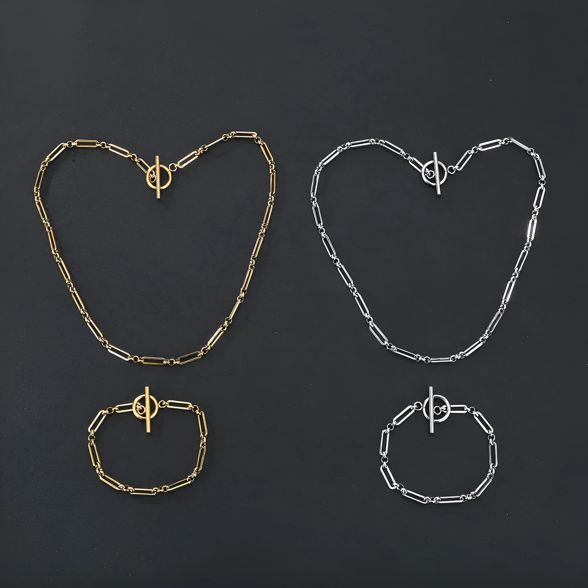 Stainless steel Chopin chain necklace and bracelet set in gold finish on white background