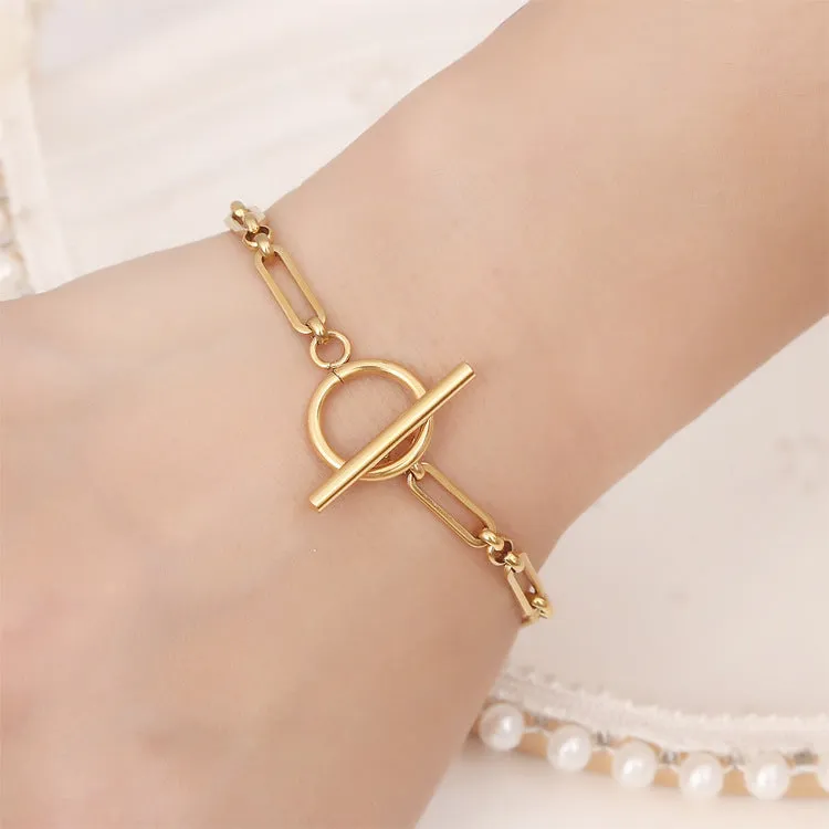 Stainless steel Chopin chain necklace and bracelet set in gold finish on white background