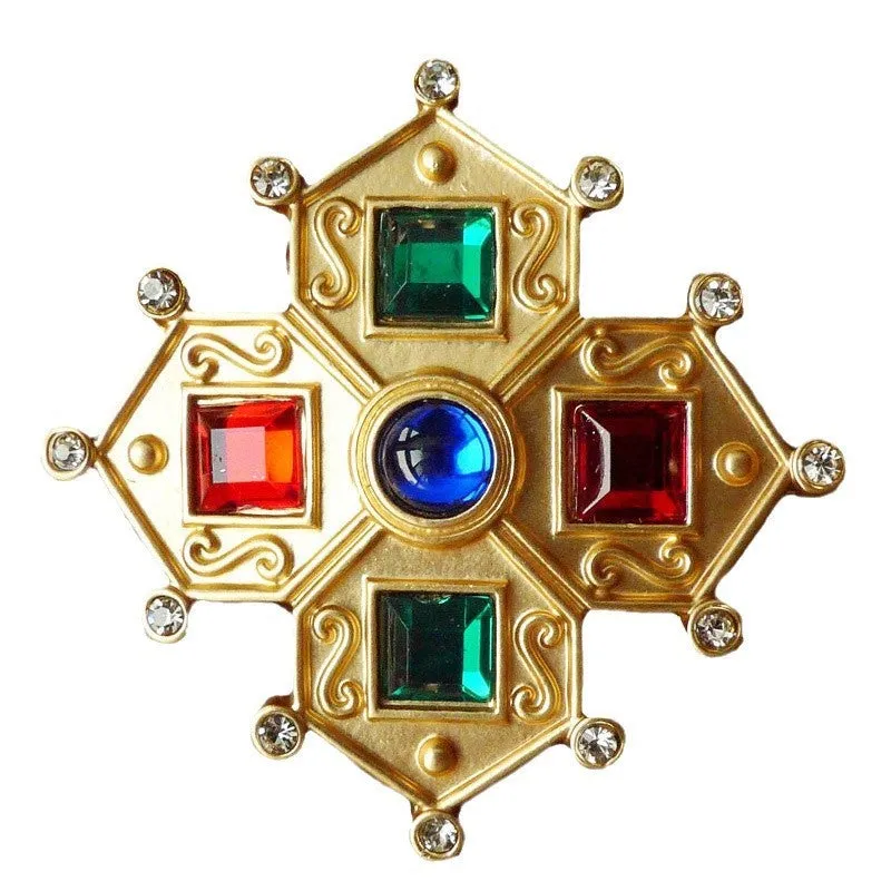 A selection of eight different zinc alloy retro baroque brooches in a diamond shape on a fabric background.