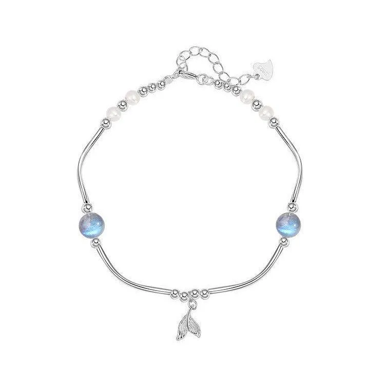 Pearl fishtail bracelet with irregular asymmetric bow in alloy
