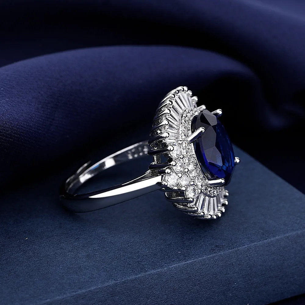 White gold colour copper crown shape ring with sea blue heart centrepiece and open mouth adjustable design