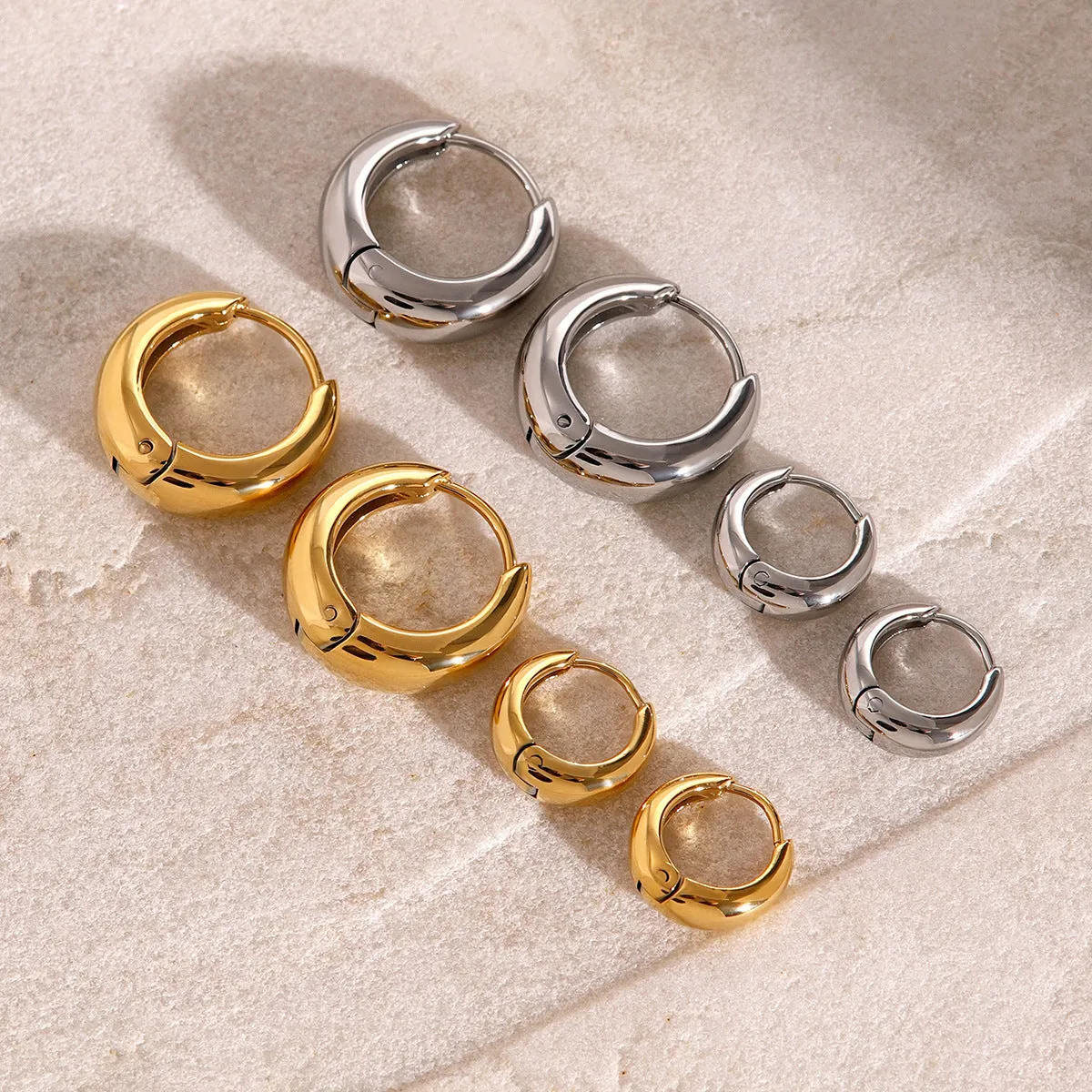 Women's geometric circle earrings in stainless steel with electroplated finish, one colour variant