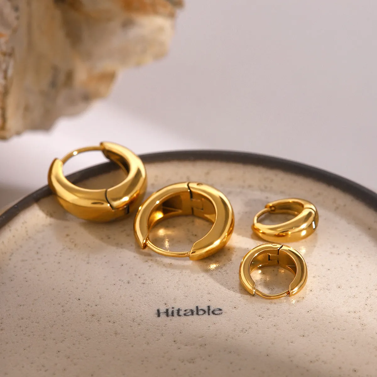 Women's geometric circle earrings in stainless steel with electroplated finish, one colour variant
