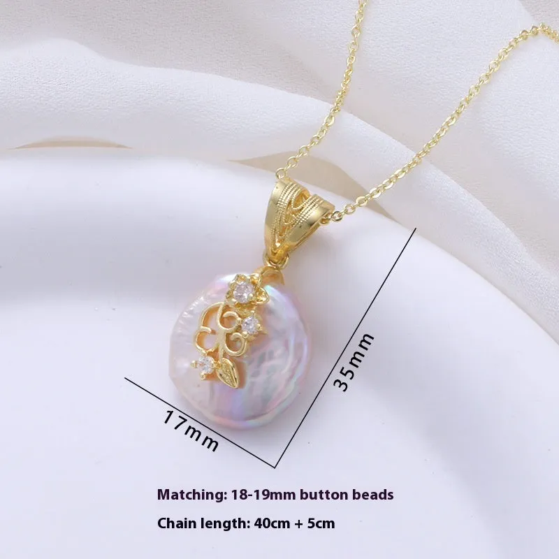 Women's matching baroque pearl geometry necklace with O-ring chain and earring set on display