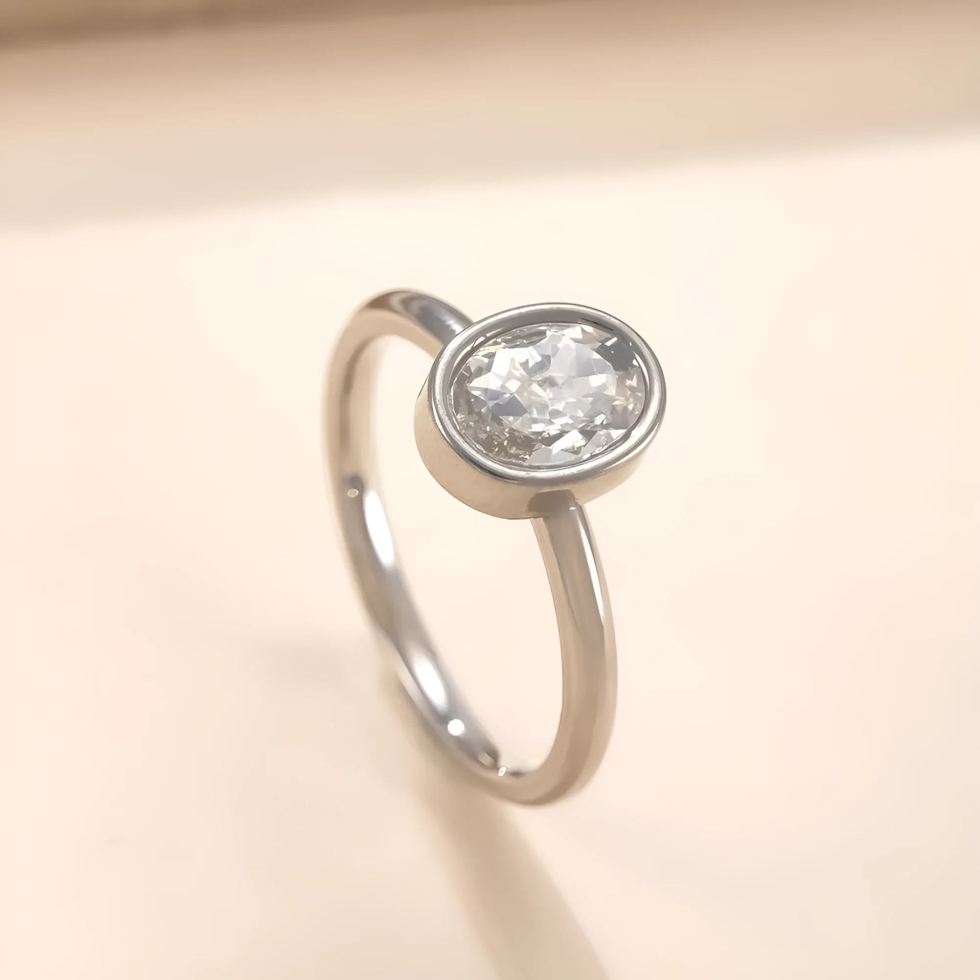 Stainless steel oval zircon ring with electroplated finish, available in steel, gold, or white gold, sizes No 6 to No 10