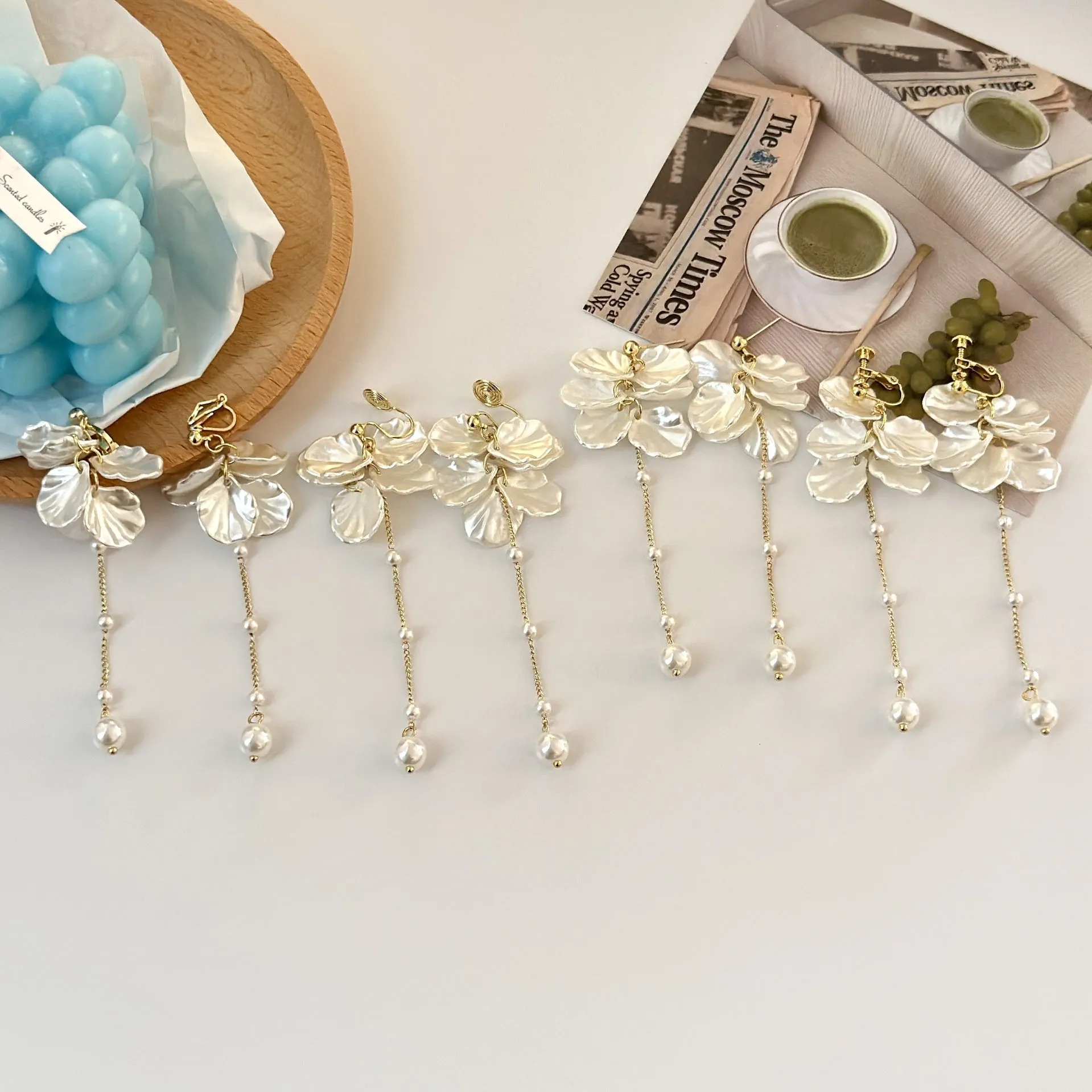 Long 8.8cm acrylic shell pearl tassel earrings for women with a choice of ear clip types.
