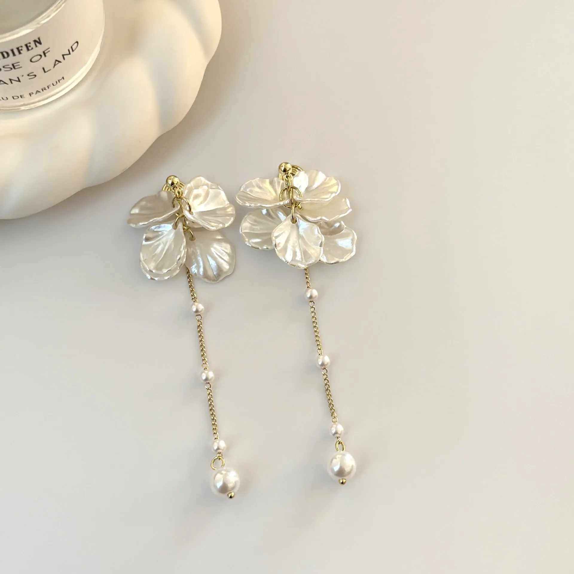 Long 8.8cm acrylic shell pearl tassel earrings for women with a choice of ear clip types.