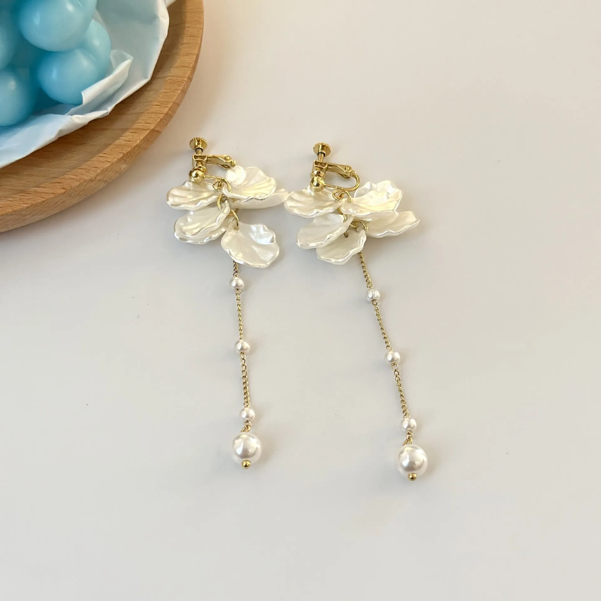 Long 8.8cm acrylic shell pearl tassel earrings for women with a choice of ear clip types.