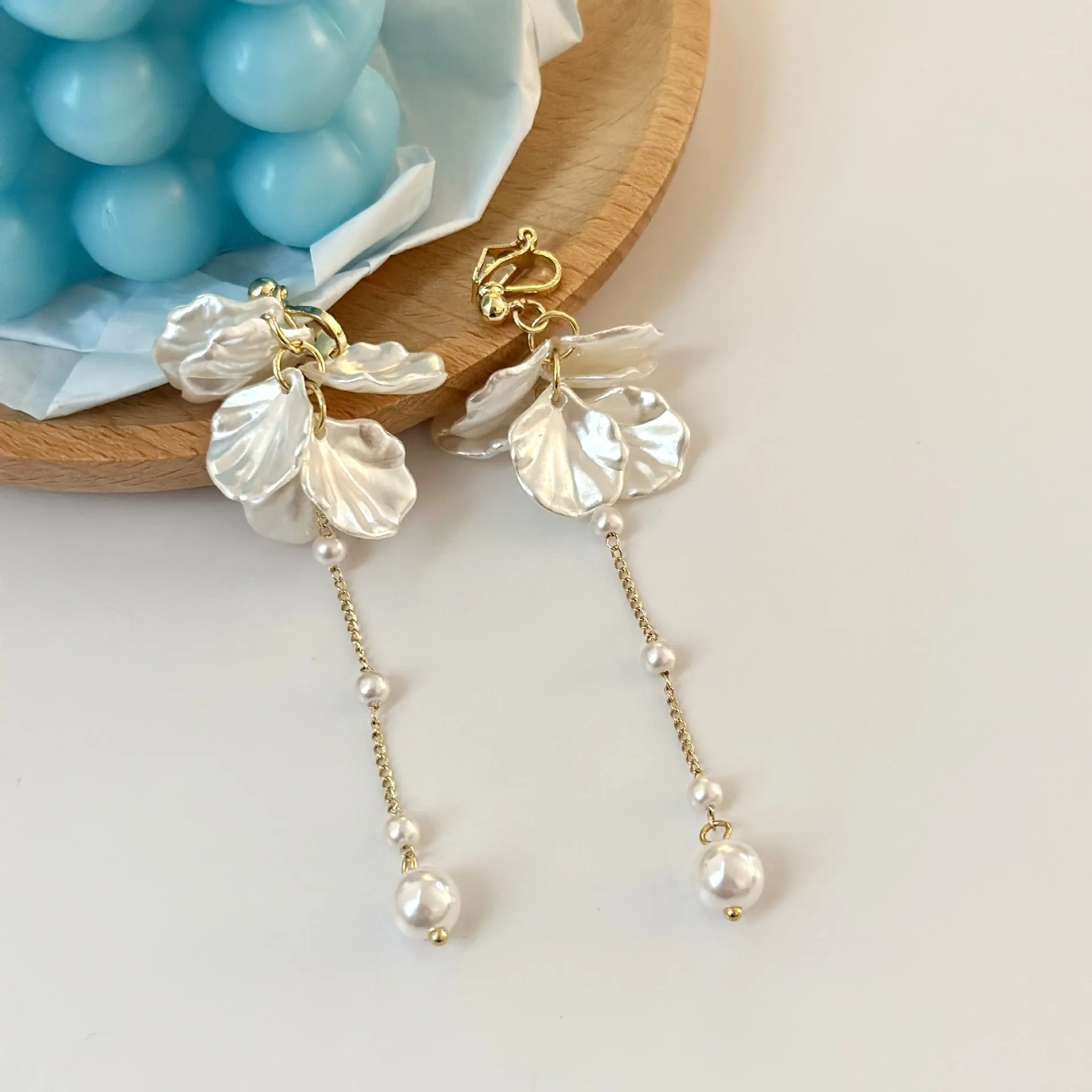 Long 8.8cm acrylic shell pearl tassel earrings for women with a choice of ear clip types.