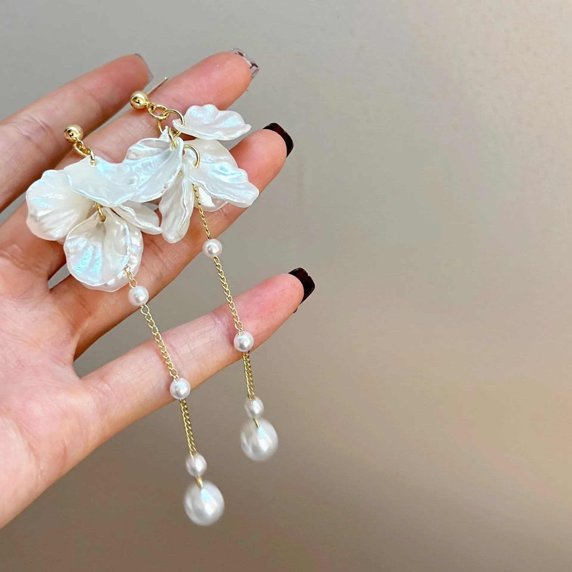 Long 8.8cm acrylic shell pearl tassel earrings for women with a choice of ear clip types.