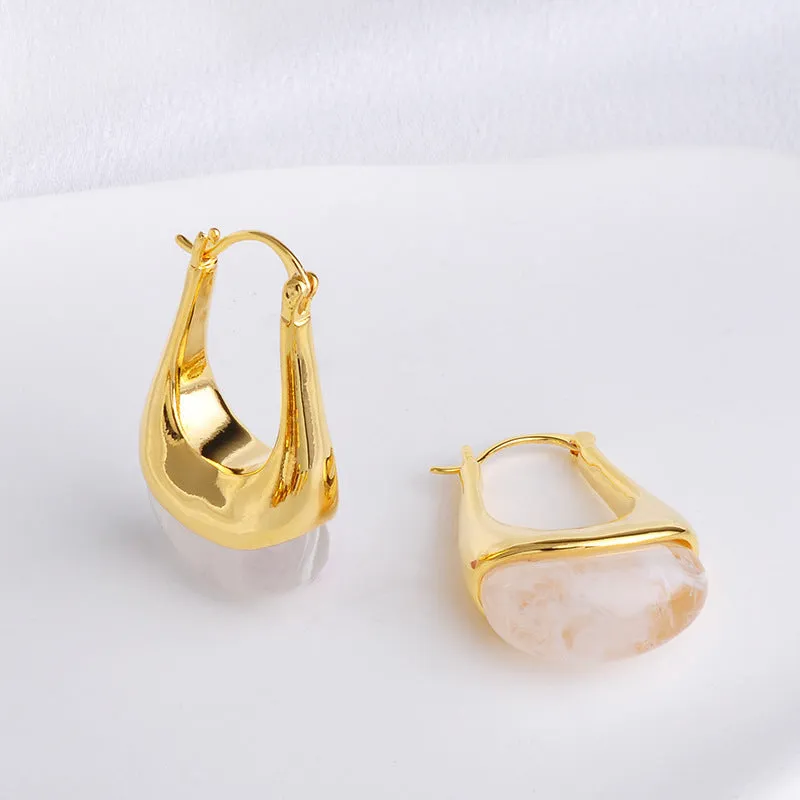 Copper geometry shape retro Maillard style earrings with electroplated finish in amber colour option on plain background