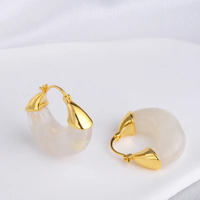 Copper geometry shape retro Maillard style earrings with electroplated finish in amber colour option on plain background