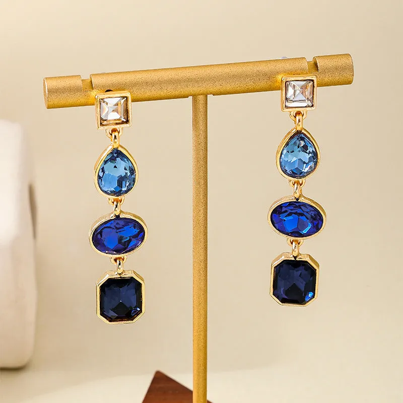 Women's geometric water drop rhinestone ear studs in royal blue alloy with silver tone setting