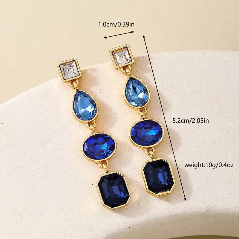 Women's geometric water drop rhinestone ear studs in royal blue alloy with silver tone setting