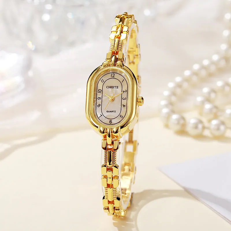 Retro oval women's quartz bracelet watch with metal strap and gold-tone dial