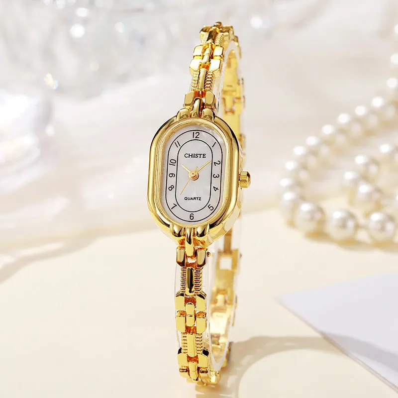 Retro oval women's quartz bracelet watch with metal strap and gold-tone dial