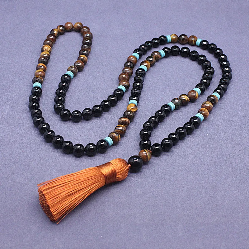 Black agate and tiger's eye geometric beaded bracelet and necklace set.