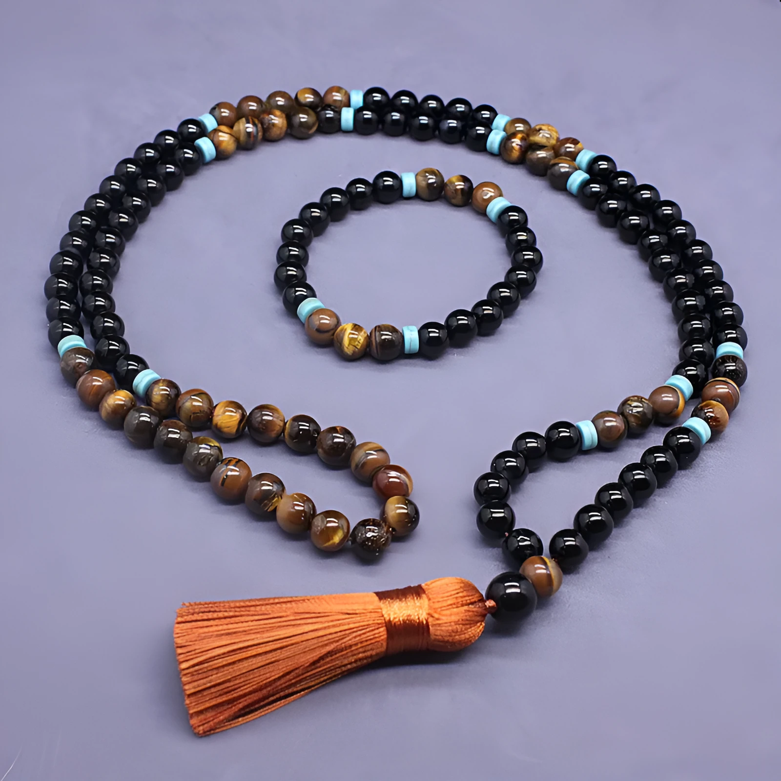 Black agate and tiger's eye geometric beaded bracelet and necklace set.