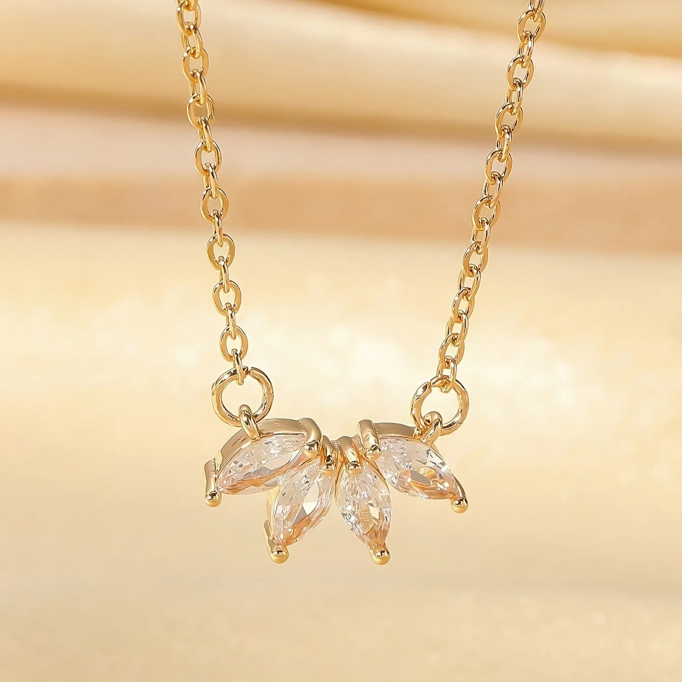 Rhinestone leaf necklace copper geometric pendant gold colour on display
