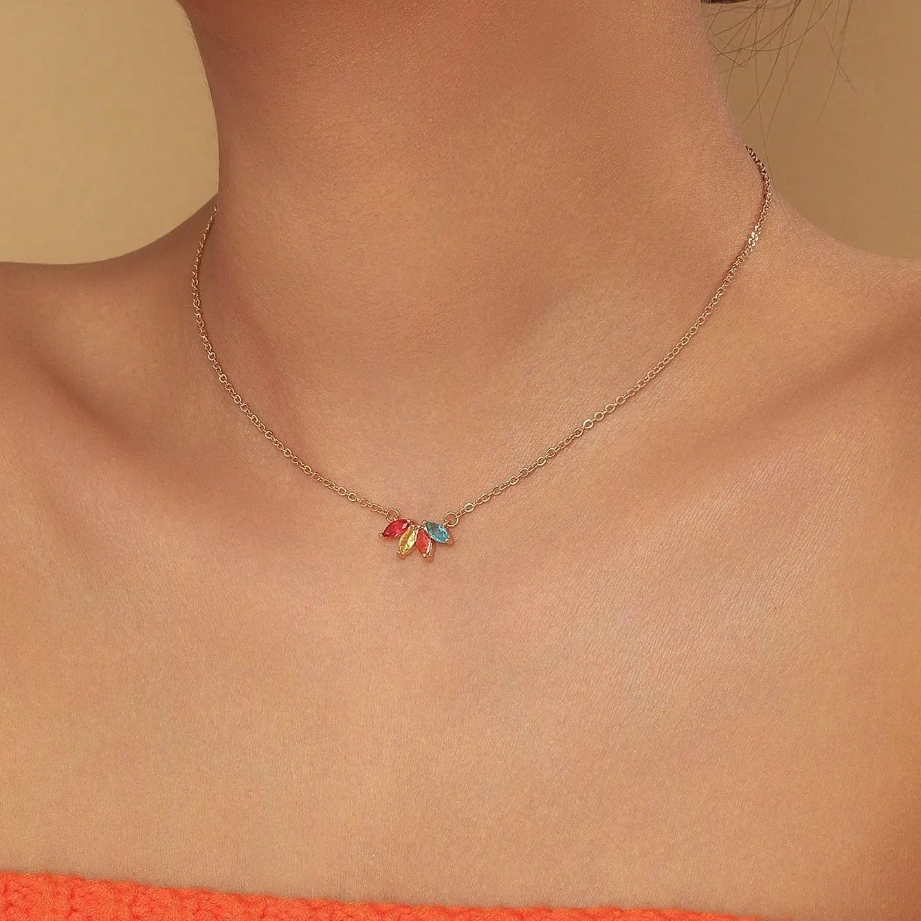 Rhinestone leaf necklace copper geometric pendant gold colour on display