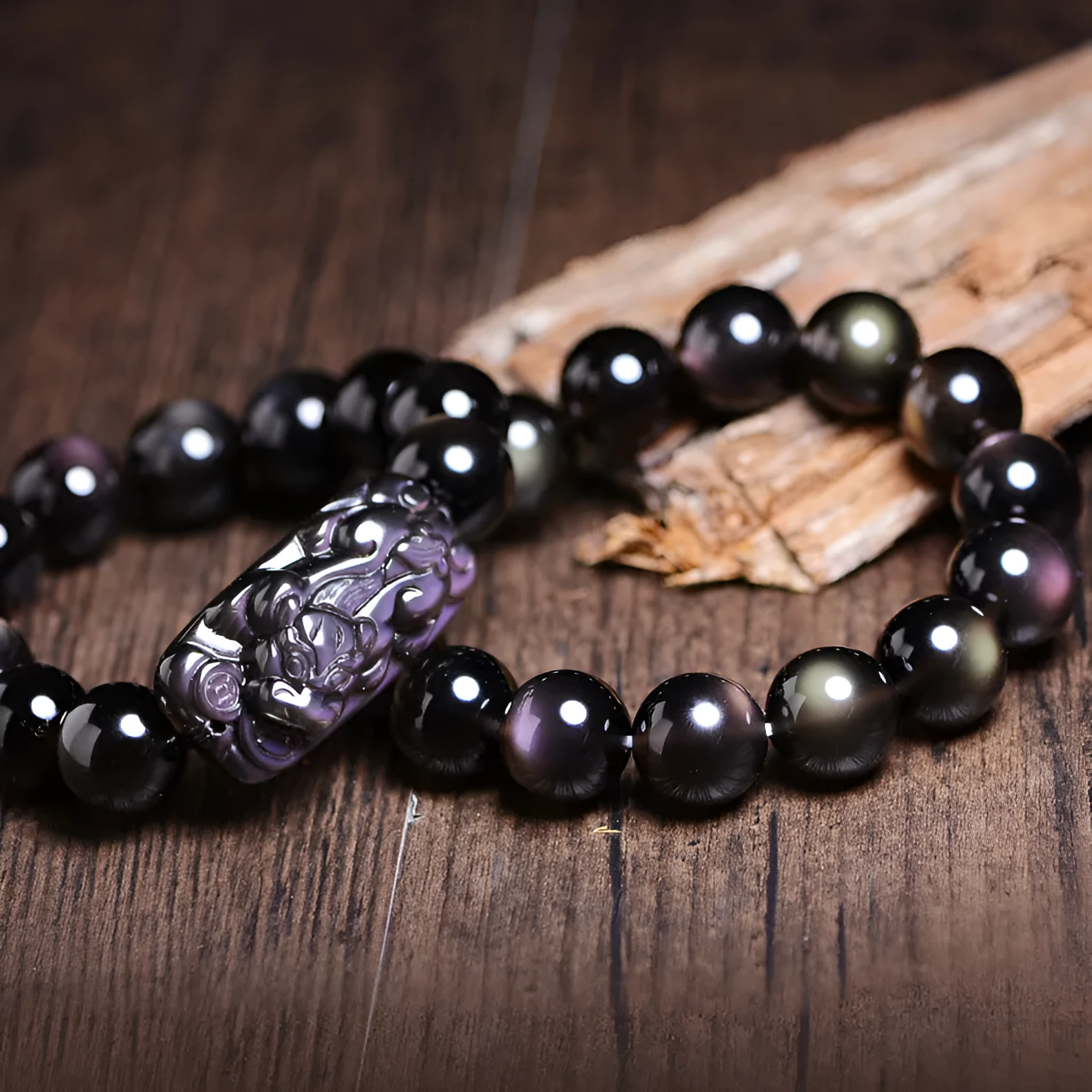 Polished crystal Pi Xiu bracelet with double-eye ice stone colouration in ethnic geometric style
