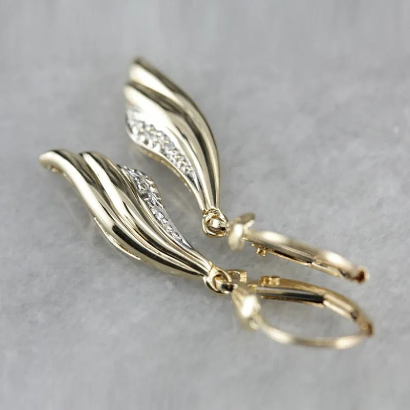 Heart shaped stud earrings in gold alloy with simple geometric design