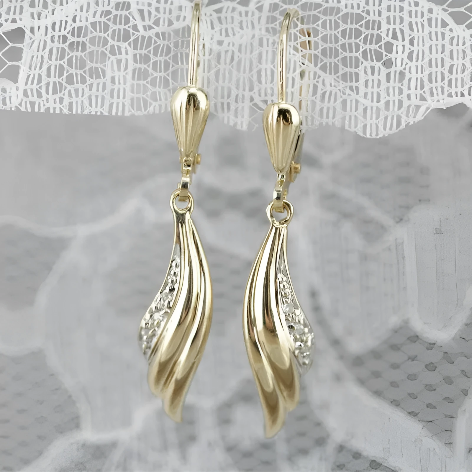Heart shaped stud earrings in gold alloy with simple geometric design
