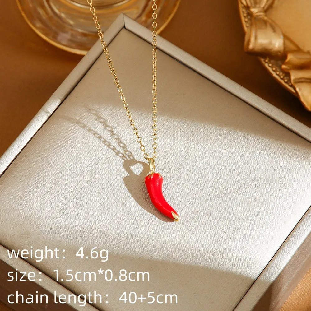 Titanium steel fashion necklace with indie cherry pendant on an O-ring chain, shown in golden colour.