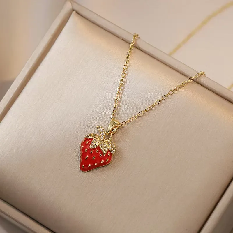 Titanium steel fashion necklace with indie cherry pendant on an O-ring chain, shown in golden colour.