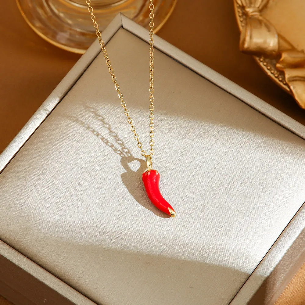 Titanium steel fashion necklace with indie cherry pendant on an O-ring chain, shown in golden colour.