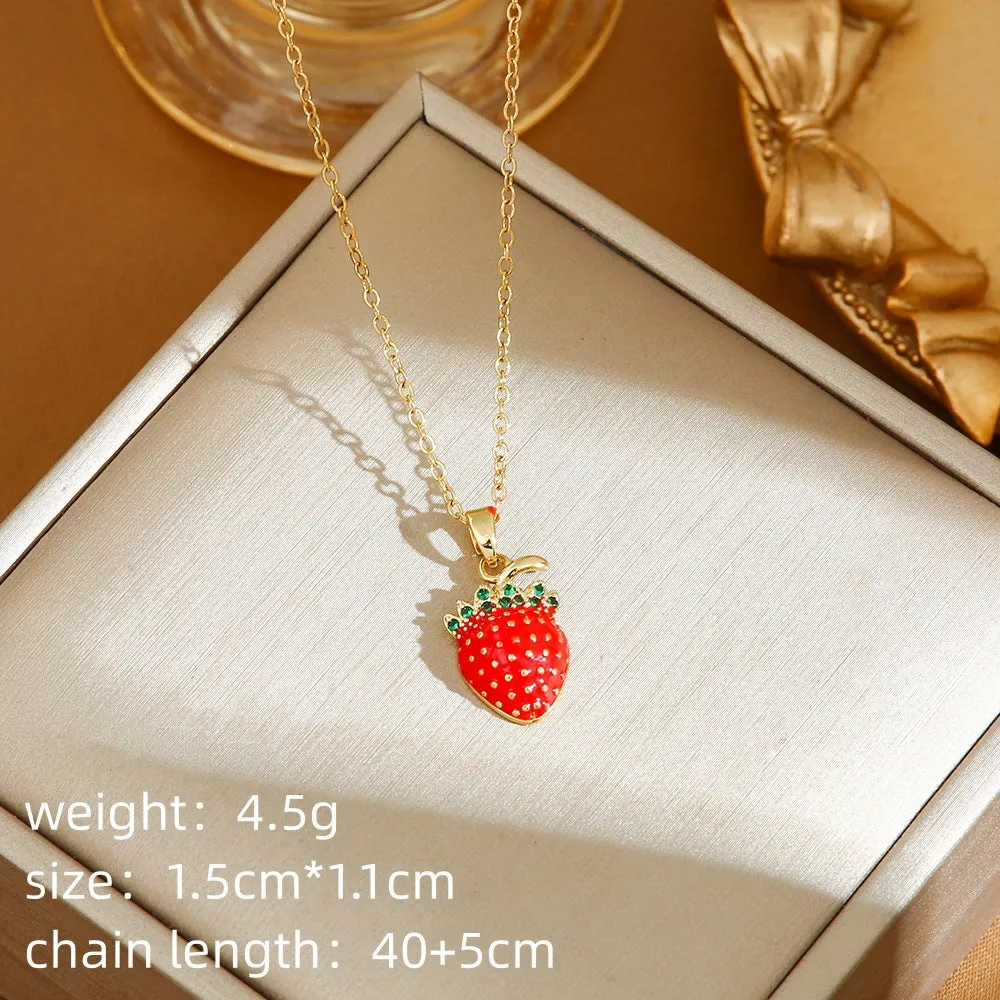 Titanium steel fashion necklace with indie cherry pendant on an O-ring chain, shown in golden colour.
