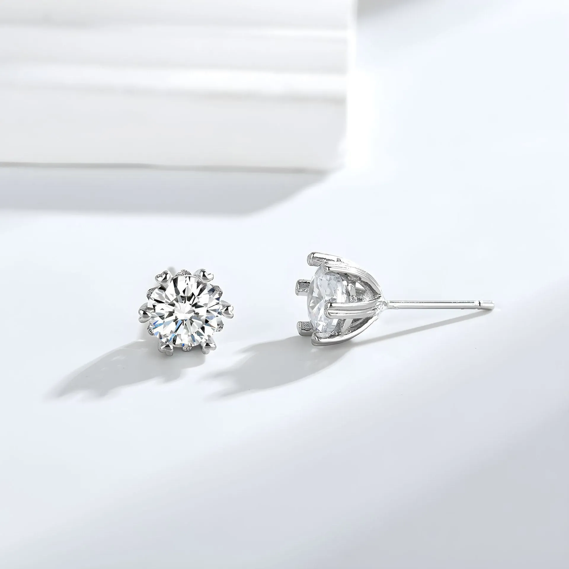 Silver brass zircon stud earrings heart shape hexagonal star design classic six-claw setting on white background