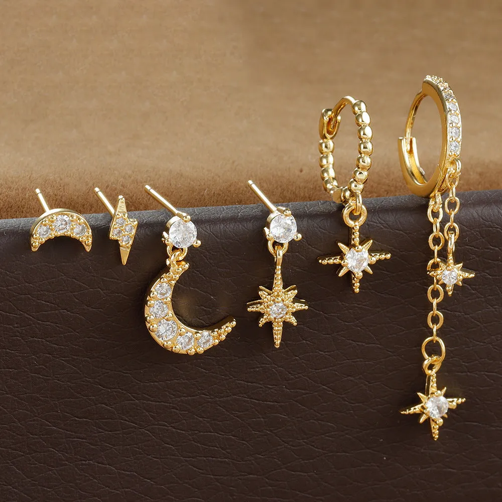 Six gold-coloured chain tassel earrings with zircon stones arranged together